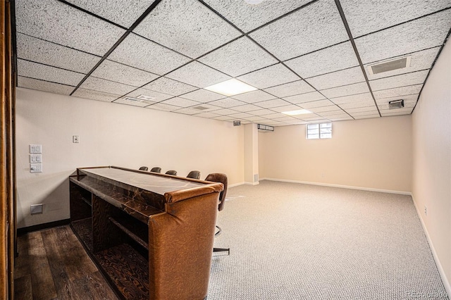 playroom featuring hardwood / wood-style floors and a paneled ceiling