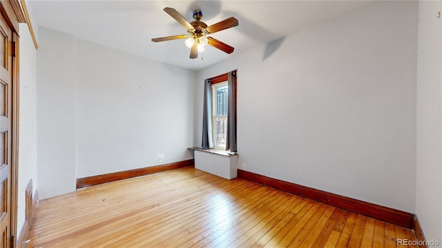 unfurnished room with ceiling fan and light hardwood / wood-style floors