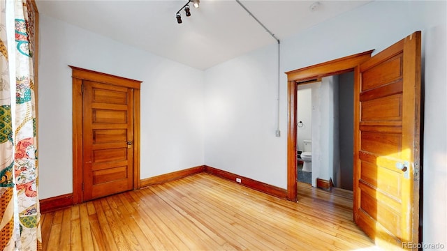 unfurnished room with light hardwood / wood-style flooring