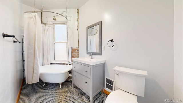 full bathroom with tile patterned flooring, vanity, toilet, and separate shower and tub