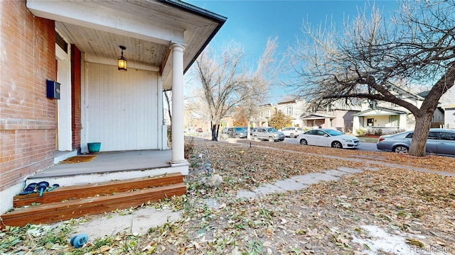 view of yard featuring covered porch