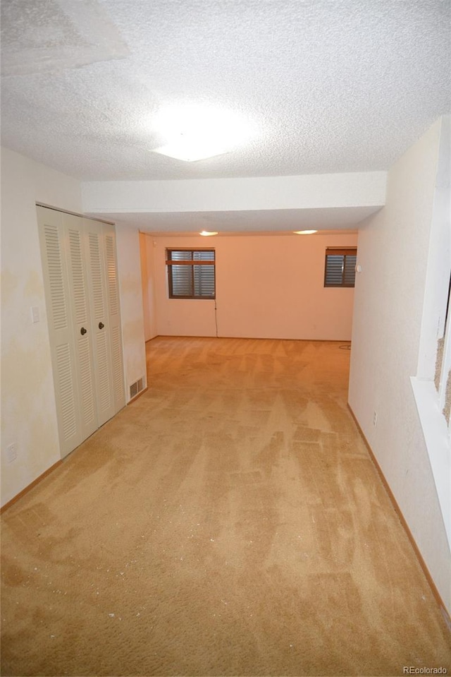 interior space with a textured ceiling