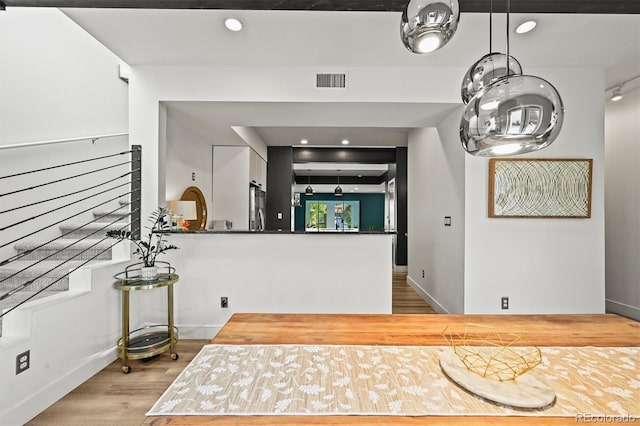 2565 Champa St, Denver, CO 80205 - kitchen featuring wood finished floors, stainless steel refrigerator, and recessed lighting