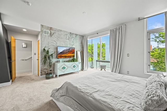 2565 Champa St, Denver, CO 80205 - carpeted bedroom with an accent wall and baseboards