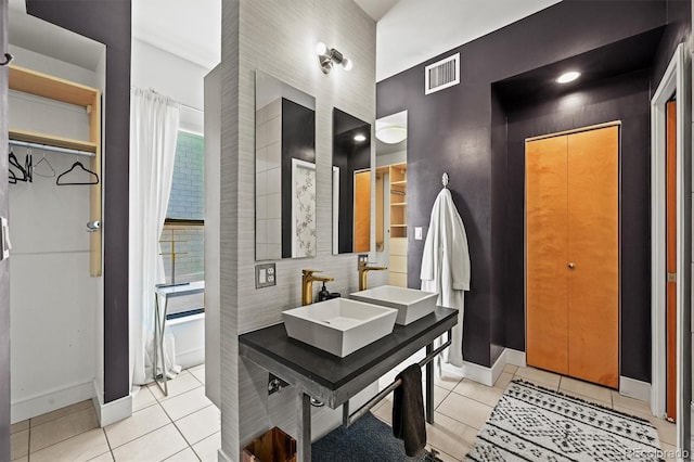 2565 Champa St, Denver, CO 80205 - bathroom featuring tile patterned flooring and double vanity