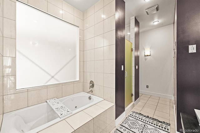 2565 Champa St, Denver, CO 80205 - bathroom with tile patterned floors and a whirlpool tub
