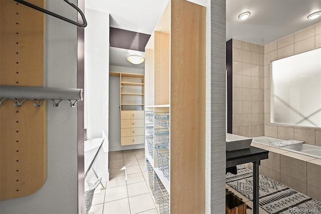 2565 Champa St, Denver, CO 80205 - full bathroom with tile patterned floors and tiled bath
