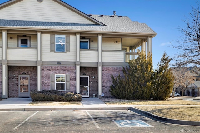 view of front of house featuring a balcony