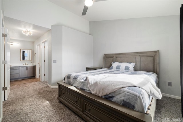 bedroom featuring connected bathroom, sink, ceiling fan, and carpet flooring