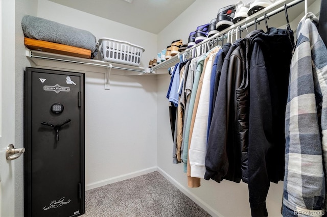 walk in closet with carpet flooring