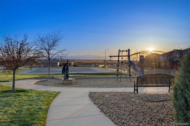 exterior space featuring a mountain view and a playground