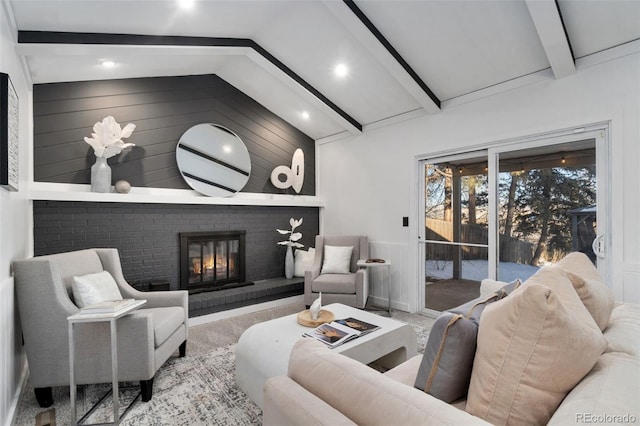 living room with lofted ceiling with beams, wooden walls, and a fireplace