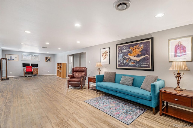 living room with light hardwood / wood-style flooring