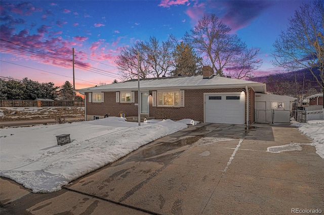 ranch-style house featuring a garage