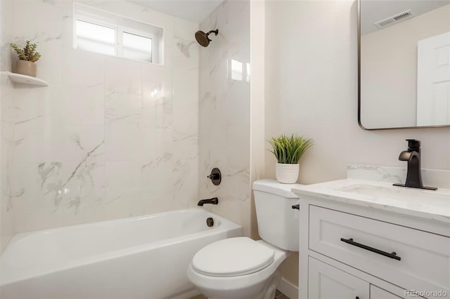 full bathroom featuring vanity, toilet, and tiled shower / bath