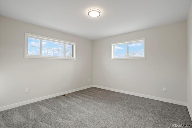 empty room with carpet flooring