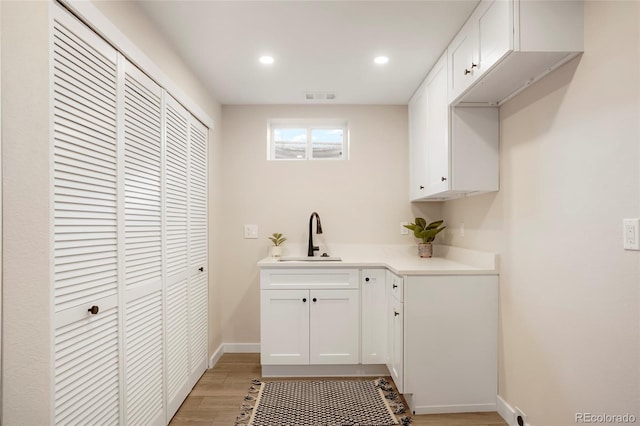 interior space featuring light hardwood / wood-style floors and sink