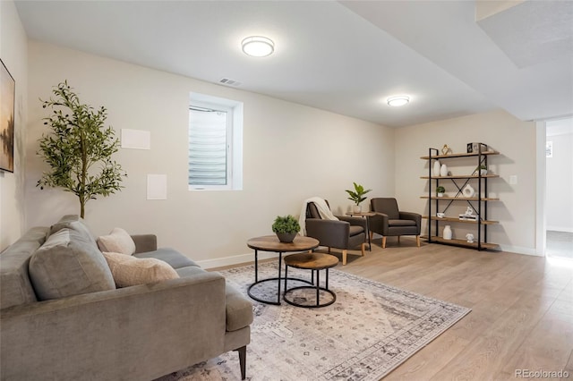 living room with light hardwood / wood-style flooring