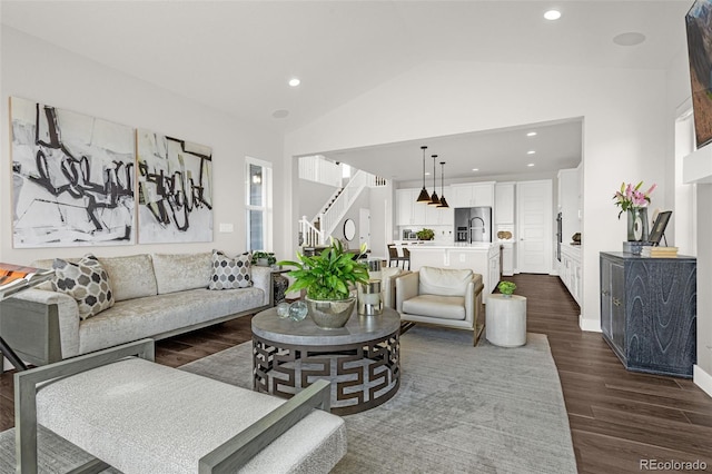 174 Rockingham Cir, Castle Pines, CO 80108 - living area with stairway, lofted ceiling, dark wood finished floors, recessed lighting, and baseboards