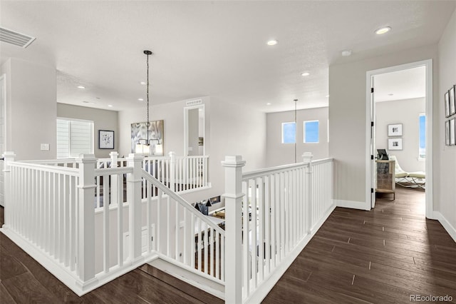 174 Rockingham Cir, Castle Pines, CO 80108 - hall with an upstairs landing, recessed lighting, dark wood-style flooring, baseboards, and a chandelier