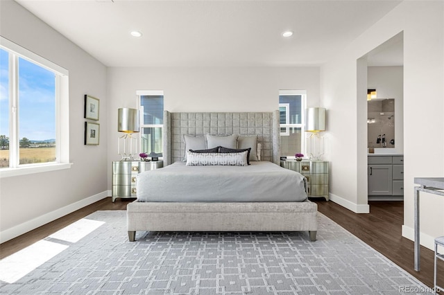 174 Rockingham Cir, Castle Pines, CO 80108 - bedroom with wood finished floors, baseboards, recessed lighting, and ensuite bath