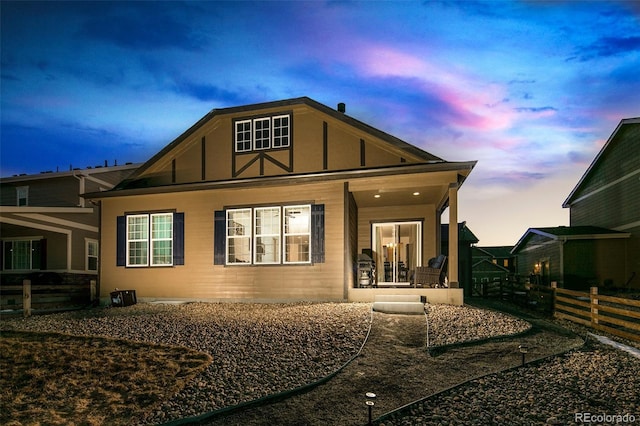 4722 S Netherland St, Centennial, CO 80015 - back of house at dusk with a porch and board and batten siding