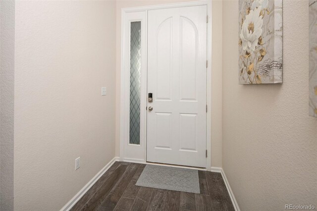 4722 S Netherland St, Centennial, CO 80015 - entryway featuring dark wood finished floors and a textured wall