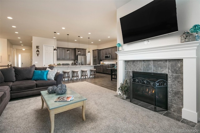 4722 S Netherland St, Centennial, CO 80015 - living room with recessed lighting, a fireplace, and wood finished floors