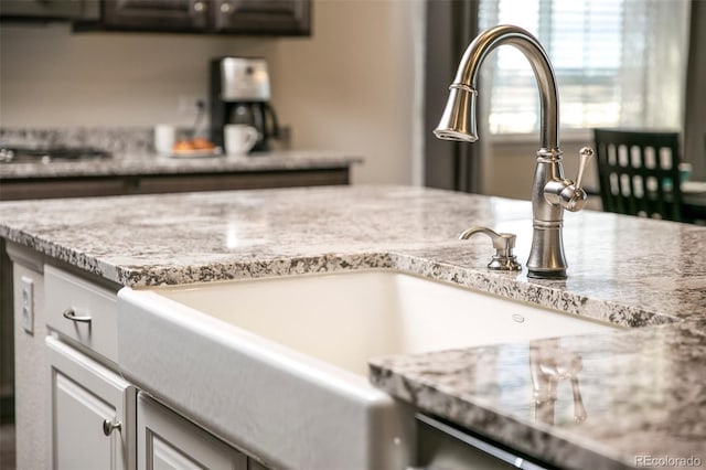 4722 S Netherland St, Centennial, CO 80015 - detailed view of light stone countertops and white cabinets