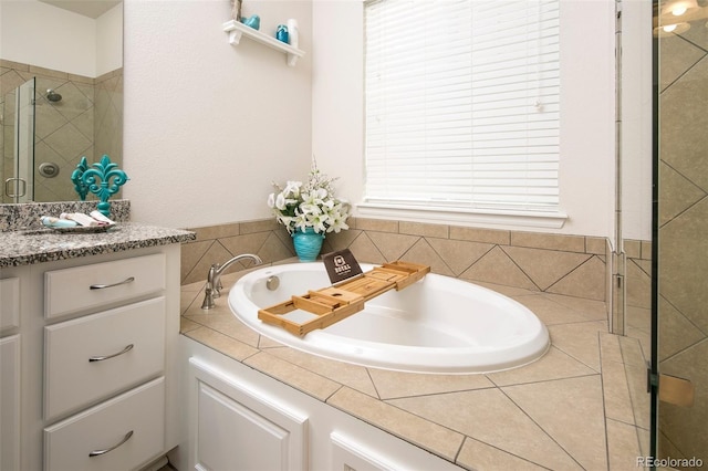 4722 S Netherland St, Centennial, CO 80015 - full bathroom featuring a garden tub, a stall shower, and vanity