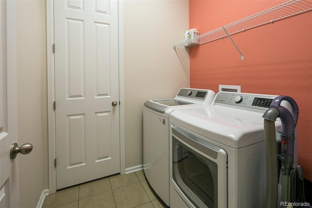 4722 S Netherland St, Centennial, CO 80015 - laundry area with separate washer and dryer and light tile patterned flooring