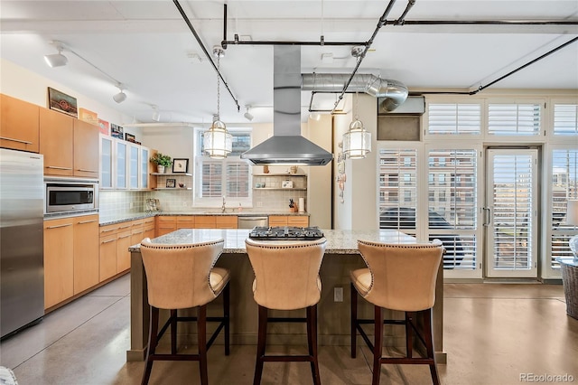 1610 Little Raven St Unit 407, Denver, CO 80202 - kitchen featuring appliances with stainless steel finishes, open shelves, concrete flooring, decorative backsplash, and light brown cabinetry
