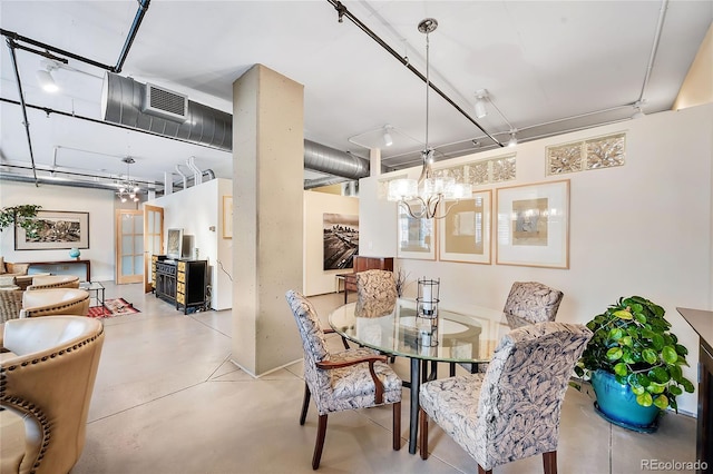 1610 Little Raven St Unit 407, Denver, CO 80202 - dining room with concrete flooring and a chandelier