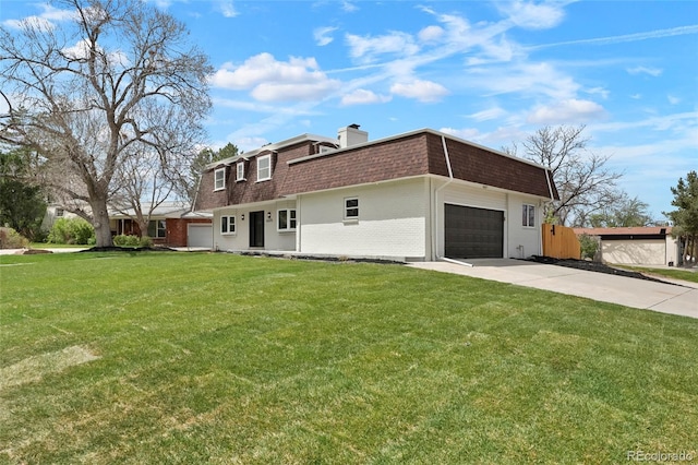 6325 W Portland Pl, Littleton, CO 80128 - view of front facade featuring roof with shingles, mansard roof, brick siding, a garage, and driveway
