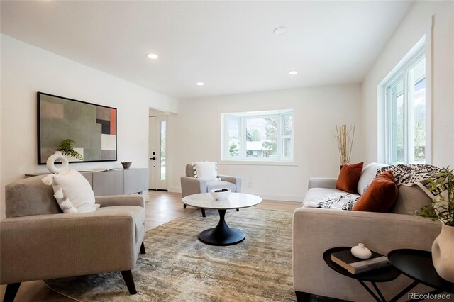 6325 W Portland Pl, Littleton, CO 80128 - living room with plenty of natural light, recessed lighting, and light wood finished floors