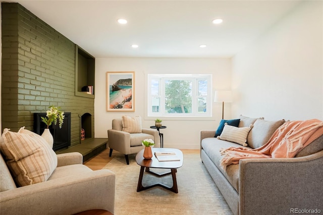 6325 W Portland Pl, Littleton, CO 80128 - living room featuring a fireplace, light wood finished floors, and recessed lighting