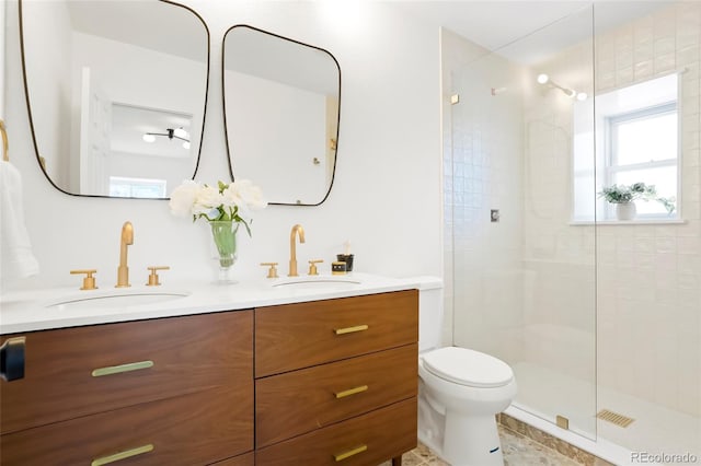 6325 W Portland Pl, Littleton, CO 80128 - bathroom featuring plenty of natural light, a stall shower, toilet, and double vanity
