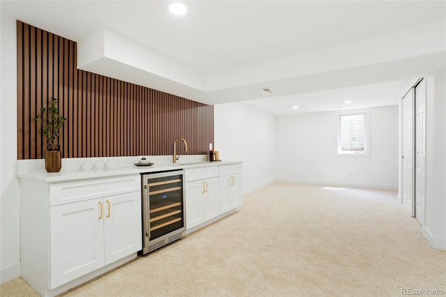 6325 W Portland Pl, Littleton, CO 80128 - indoor wet bar with beverage cooler, light carpet, recessed lighting, and baseboards