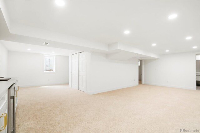 6325 W Portland Pl, Littleton, CO 80128 - basement with light carpet, recessed lighting, and baseboards