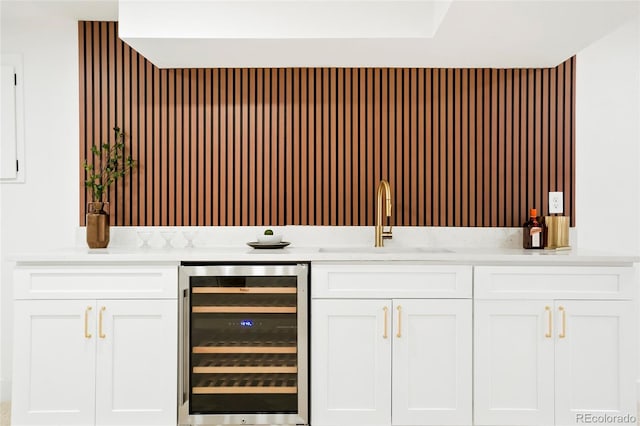 6325 W Portland Pl, Littleton, CO 80128 - bar featuring wine cooler and a sink
