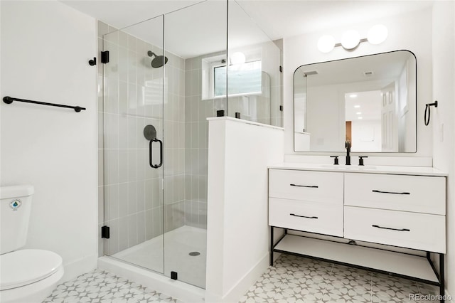 6325 W Portland Pl, Littleton, CO 80128 - full bathroom with toilet, a stall shower, and baseboards