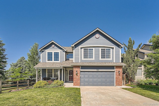 view of front of home featuring a front yard and a garage