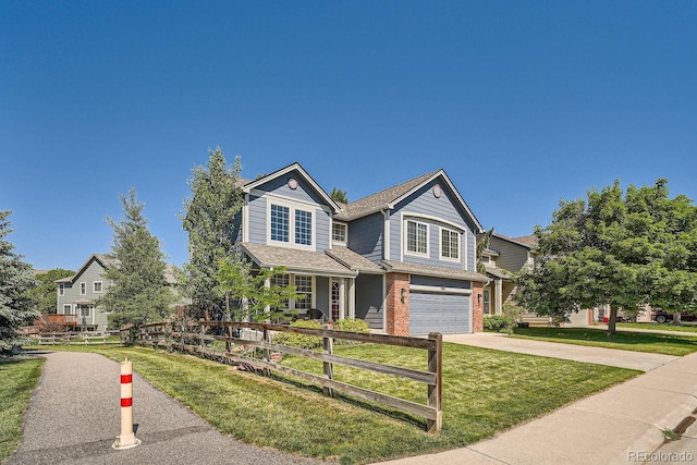 craftsman house with a garage and a front lawn