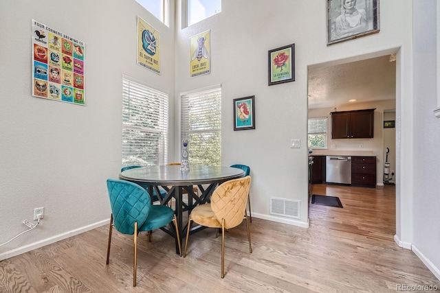 dining room with light wood-type flooring