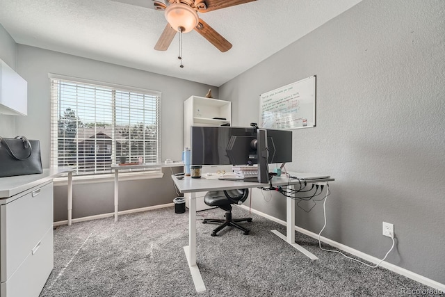 office area with a textured ceiling, carpet floors, and ceiling fan