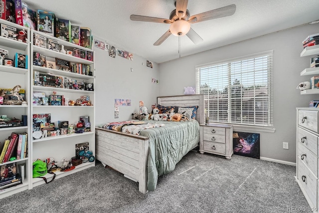 bedroom with carpet, ceiling fan, and a textured ceiling