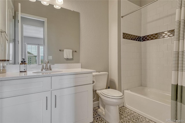 full bath featuring toilet, vanity, tile patterned flooring, a textured wall, and shower / tub combo