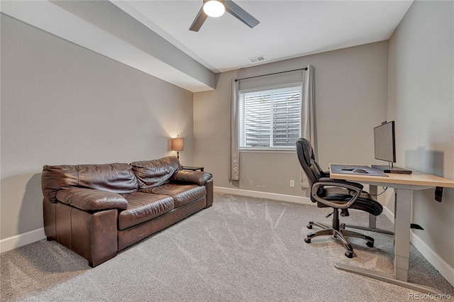 office area featuring visible vents, baseboards, a ceiling fan, and carpet floors