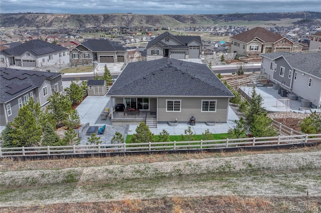 back of house with a patio, a residential view, and a fenced backyard