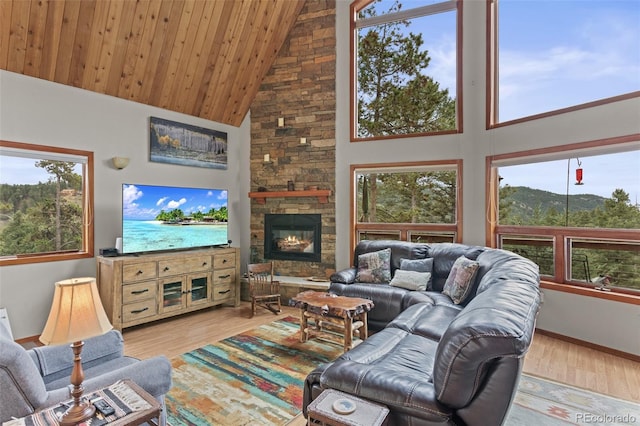 12191 Tecumseh Trl, Conifer, CO 80433 - living room with high vaulted ceiling, wood finished floors, a fireplace, baseboards, and wooden ceiling